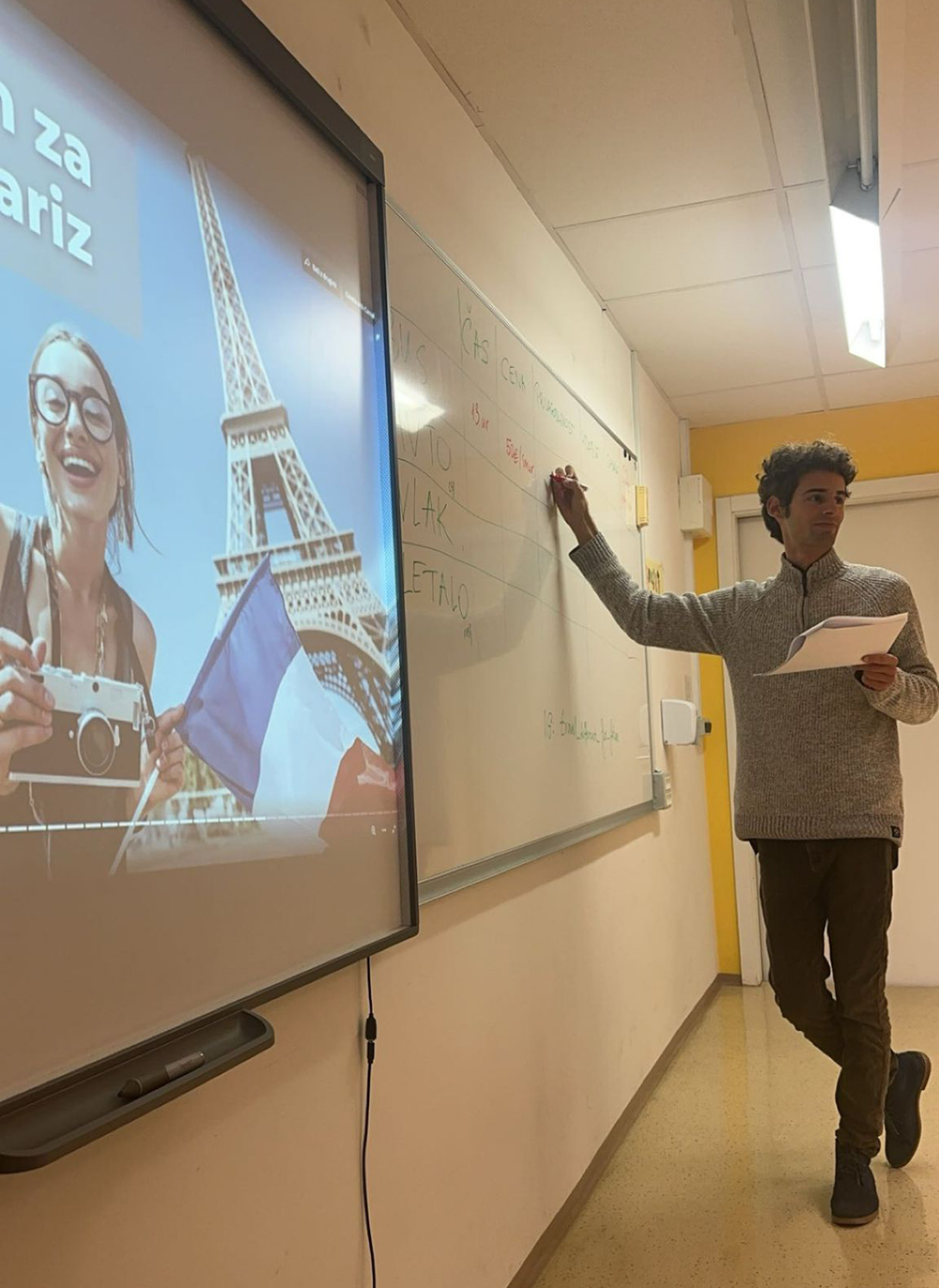 A Travel Different for Future volunteer leads an educational workshop on sustainable tourism and responsible travel in a secondary school.